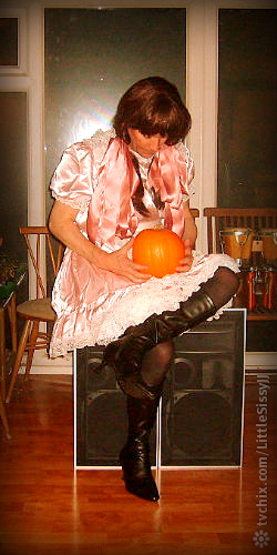 Halloween sissy with pumpkin sitting on Jamos. - Halloween sissy., Pink frilly sissy., Sissy Fashion