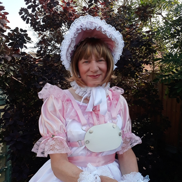 In love with pink - Showing off my pink and white dress then sent into the garden to play. Musn't get my new dress dirty though., sissy pink bonnet bloomers ribbons bows petticoats, Adult Babies,Feminization,Sissy Fashion,Dolled Up