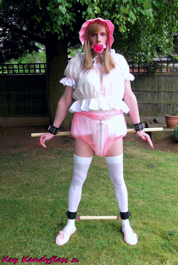 Padlocked Pansy in the Garden. - Punishment time again - Mistress Bossyboots puts me into my locking plastic panties over my nappy and buckles in my dummy gag then takes me into the garden to leave me locked between two bars so I can reflect on my poor behaviour. xxx, Sissy,sissybaby,nappy,plastic panties,dummy,gag,bondage,outdoor humiliation, Adult Babies,Feminization,Dominating Mistress Or Master,Dolled Up,Bondage,Diaper Lovers